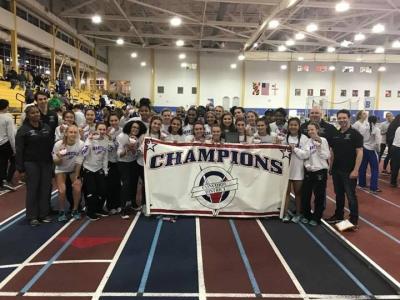 photo of girls team with district banner